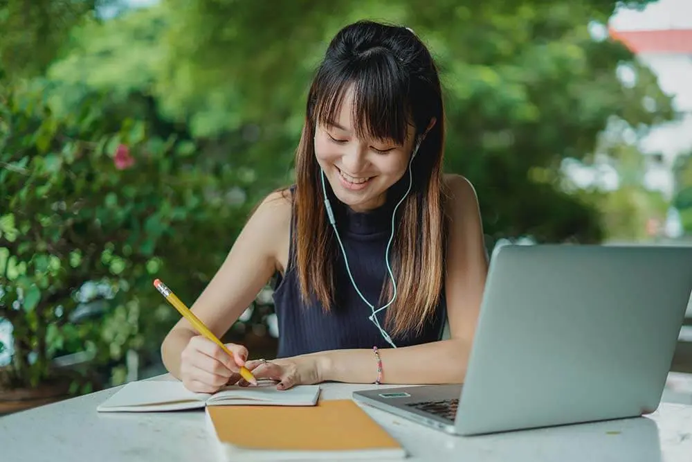 Girl studying in public park