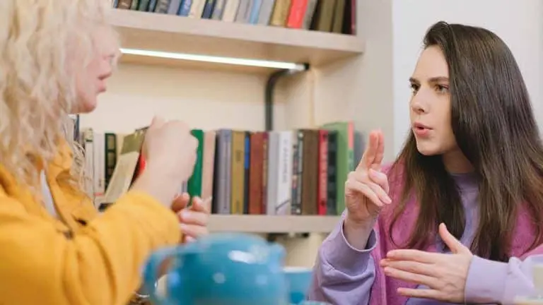 Two people using sign language
