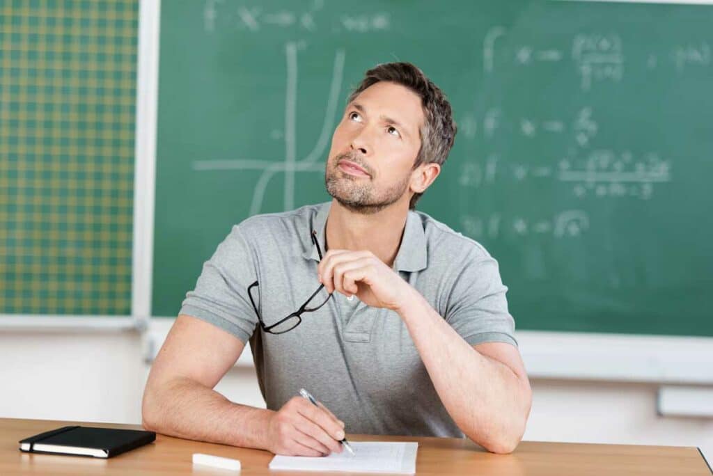 Man sitting in classroom trying to remember