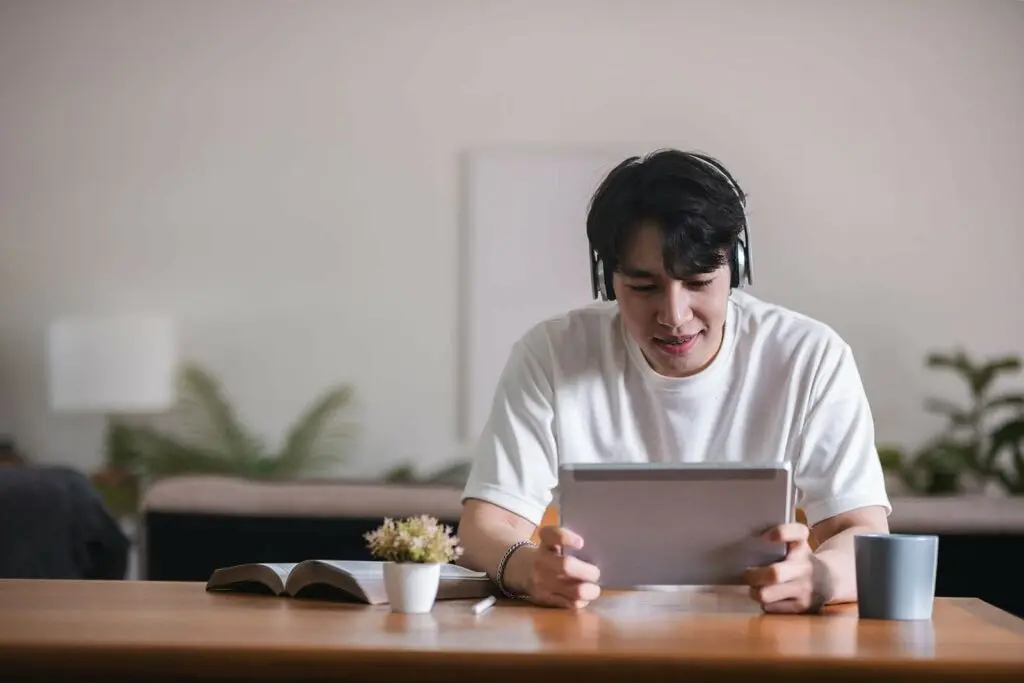 Young student participating in online learning, attending a virtual class via video call on Zoom