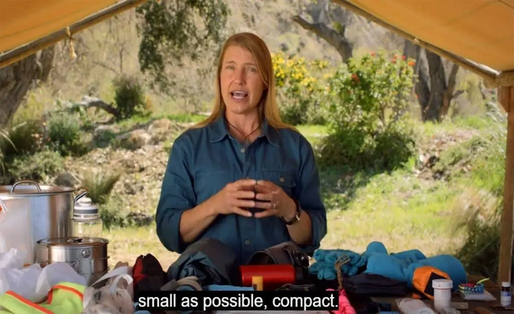 Jessie going through the contents of a survival kit
