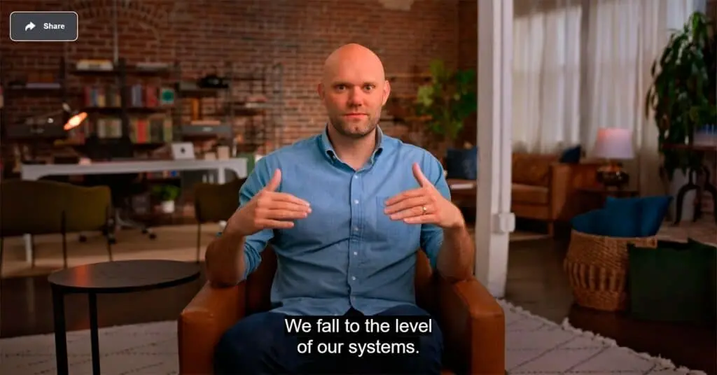a screenshot where James Clear is seen talking about Falling to Our System.