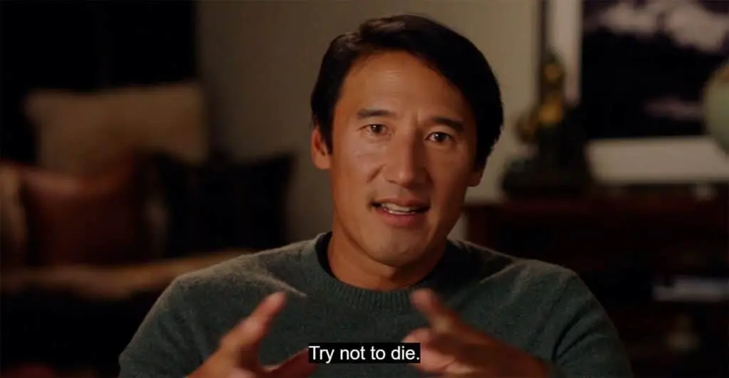 Jimmy Chin explaining high-stakes photography, subtitled “Try not to die.”