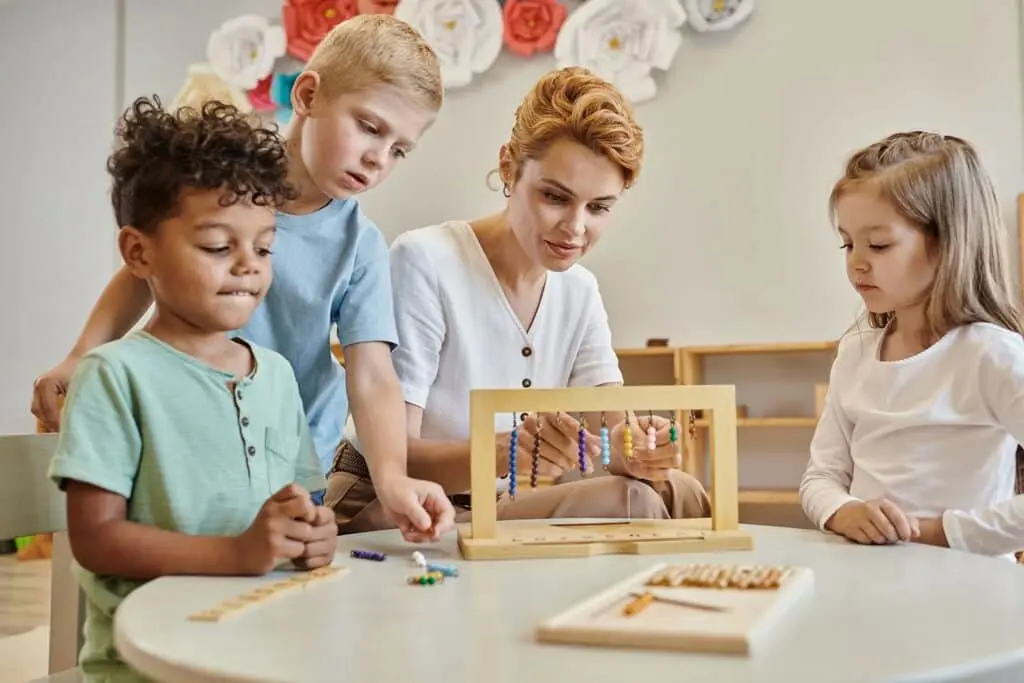 a woman with 3 children doing handicrafts