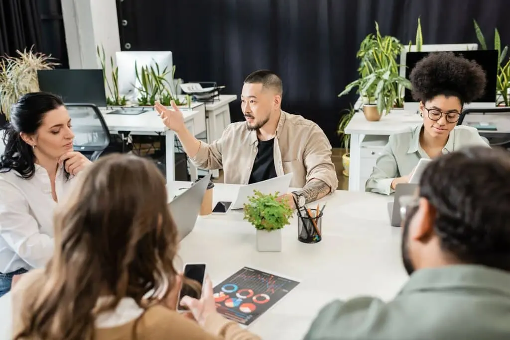 young people at work, talking about something