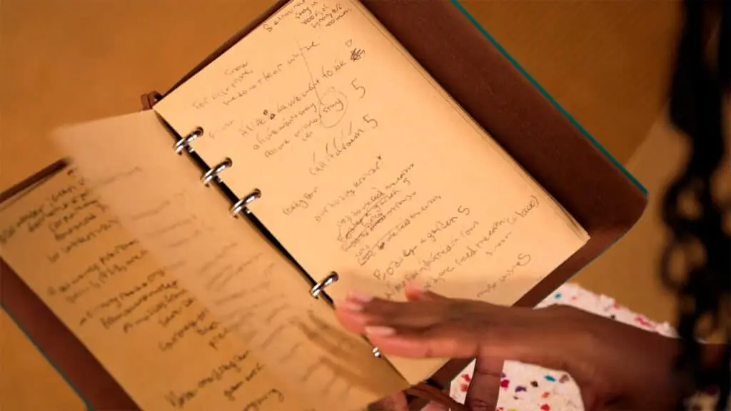 Amanda's notebook filled with research notes and brainstorming ideas
