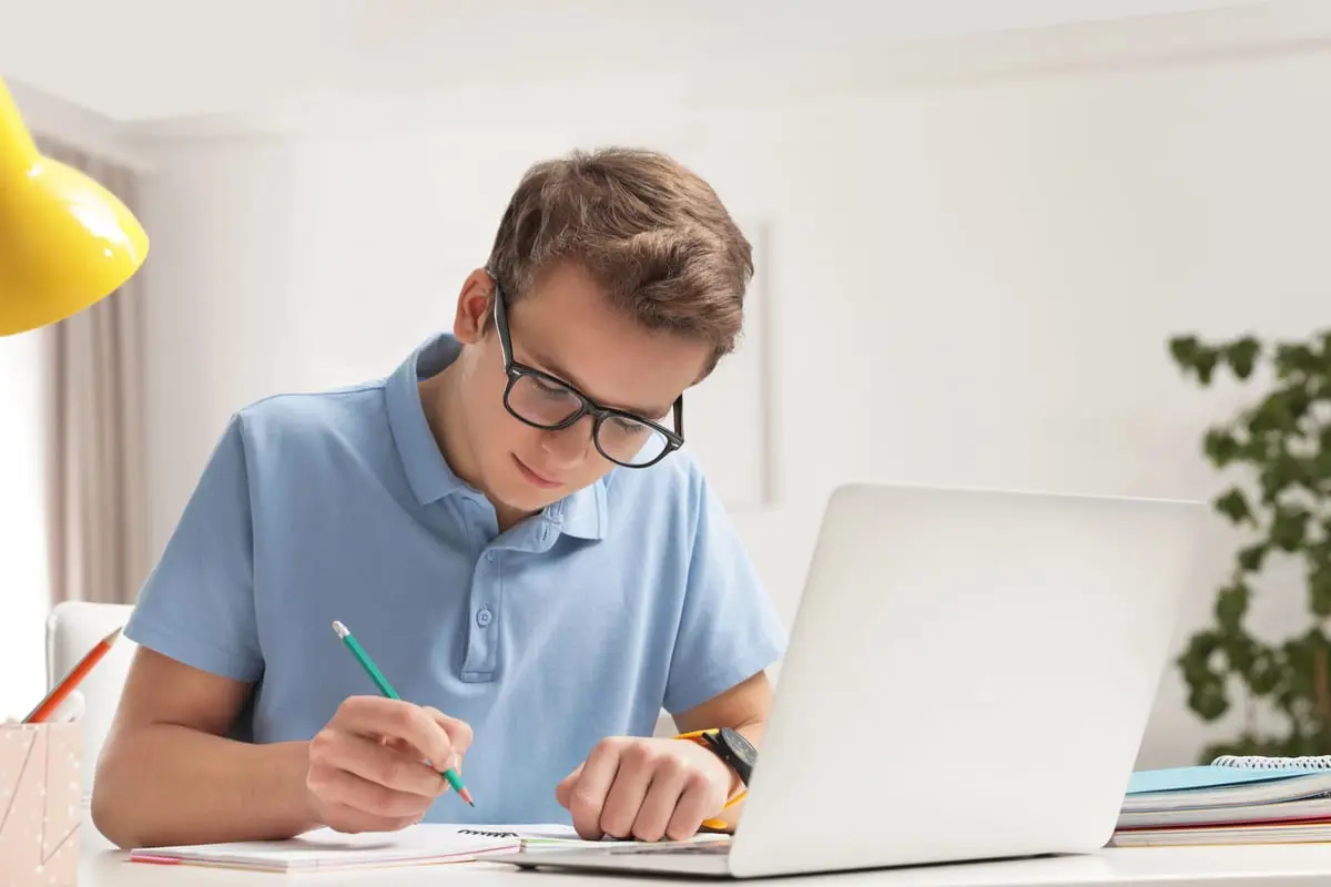 Student working through a mixed set of practice problems at a desk